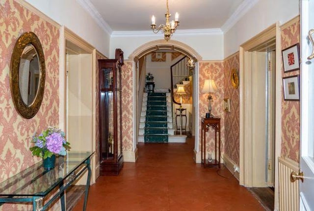 The hallway is spacious and traditionally decorated