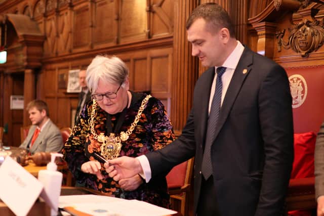 Sheffield Lord Mayor Sioned-Mair Richards and Oleksandr Symchyshyn, mayor of Khmelnytskyi, signing the official twinning of their two cities in Sheffield Town Hall