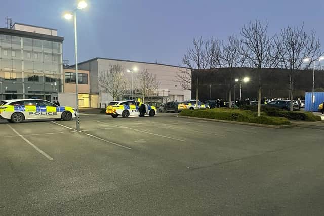 Police say ‘enquiries are ongoing’ after a 17-year-old boy was assaulted and hurt in a mass brawl in Hillsborough College car park, pictured, last night