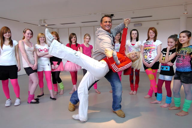 Former cricketer and Strictly Come Dancing winner Darren Gough from Barnsley demonstrating his skills on the dancefloor with the help of Campsmount School teacher Clair Knowland, watched by pupils from the school. Darren, who was visiting a Get Doncaster Dancing event, won series three of Strictly in 2005 with his professional partner, Lilia Kopylova