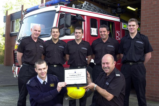 Edlington's white watch firefighters received a certificate of merit from the RSPCA for saving three horses which were trapped in stables in a rising flood in 2001. Our picture shows  RSPCA Inspector Matt Bell (front, left) presenting the award to Sub-Officer Robert Ratcliffe, watched by, from left, Les Rockett, Neil Carbutt, Simon Walters, Daryl Aitken and Mark Hunt.