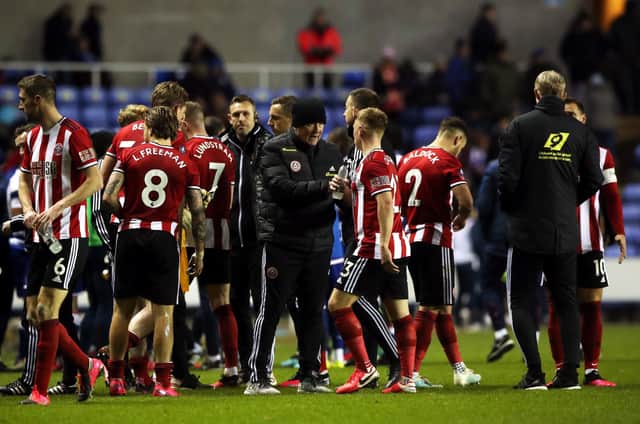 Sheffield United manager Chris Wilder (centre) speaks to Ben Osborn during the FA Cup fifth round match at the Madejski Stadium, Reading. Nick Potts/PA Wire.