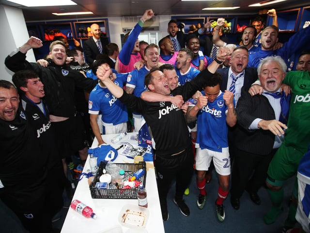 Pompey players and staff celebrate.