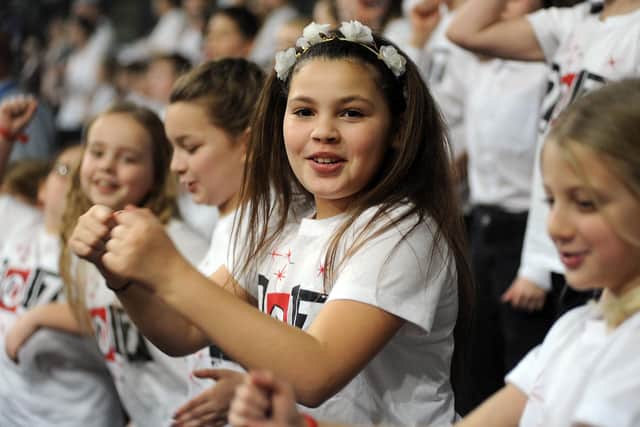 File picture shows school children take part in rehearsals for the opening night of Young Voices 2017 at Sheffield Arena. The 2022 show has been posponed. Picture Scott Merrylees