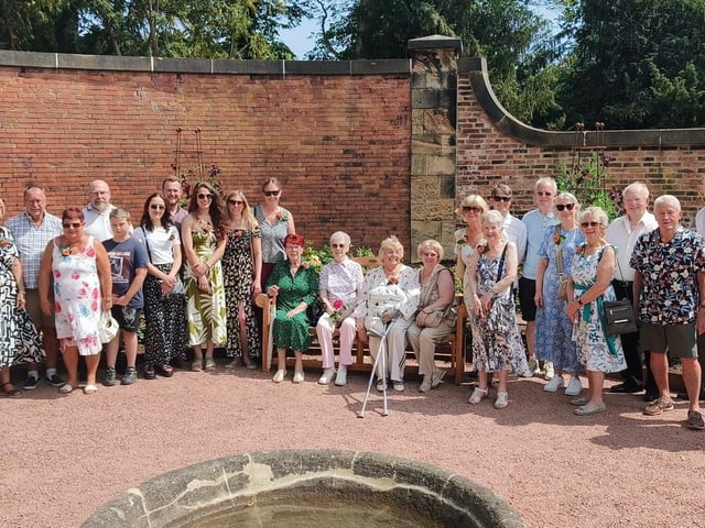 Audrey Morris (seated second left) with family and friends at the opening of the Sensory Rose Garden