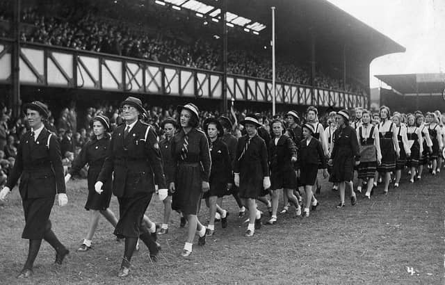 The Girls Life Brigade parading across the Fratton Park turf about 1942. Theresa Proudlock (nee Clancy) is the second girl in a white
blouse in the line furthest from the camera.
Picture: Courtesy of Michael Proudlock