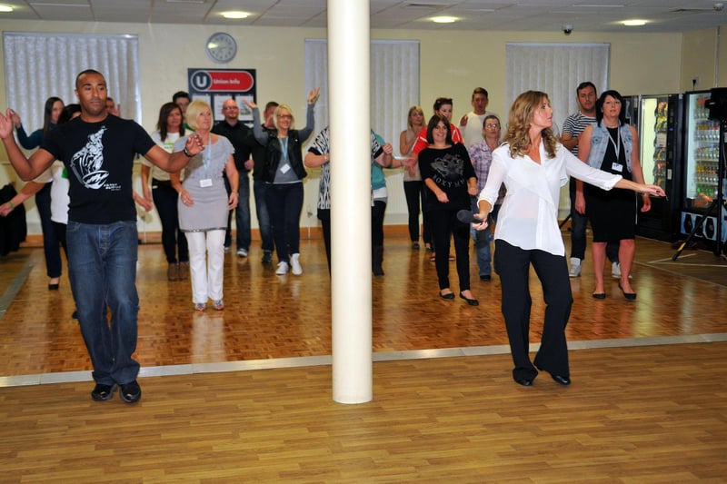 Here's 2005 finalist Colin Jackson - but this time he is on the dance floor in 2013 with former strictly favourite Erin Boag and they are dancing with NPower Peterlee staff.