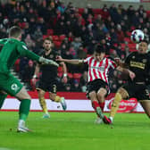 Sheffield United's George Baldock watches on as Daniel Jebbison has a shot blocked by Sunderland's Luke O'Nien: Simon Bellis / Sportimage