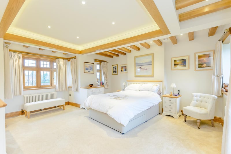 This stunning room is one of four bedrooms at the property