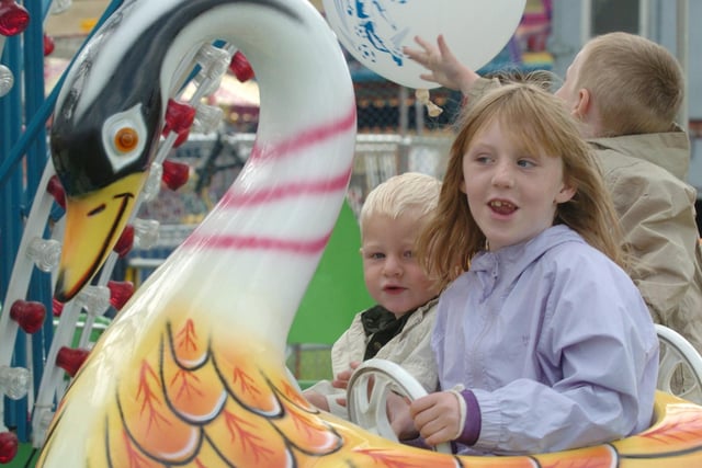 Pictured at the Norfolk Heritage Park in 2005, where the Sheffield Fayre was staged. Seen  on one of the roundabouts is Brittany Cotton with her brothers  Brandon and Bradley.