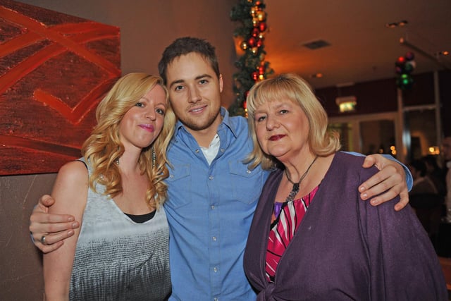 Marcus Patric with (left) Mandie Bartlett (32) and her mum Sue Bartlett (65) at Tiger Tiger in Gunwharf Quays on December 17, 2010. Picture: (104124-297)
