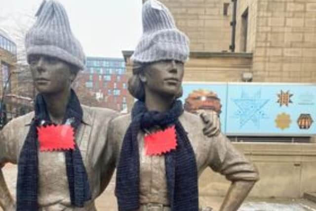 An anonymous do-gooder left a set of scarves and hats on Sheffield's Women of Steel statues for anyone to take and combat the cold. Photos by Katarzyna Pakowska.