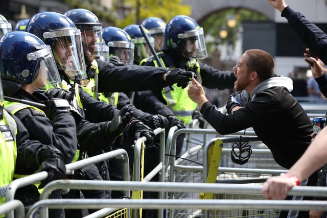 Police are confronted by protesters in Whitehall near Parliament Square. Picture: Jonathan Brady/PA Wire