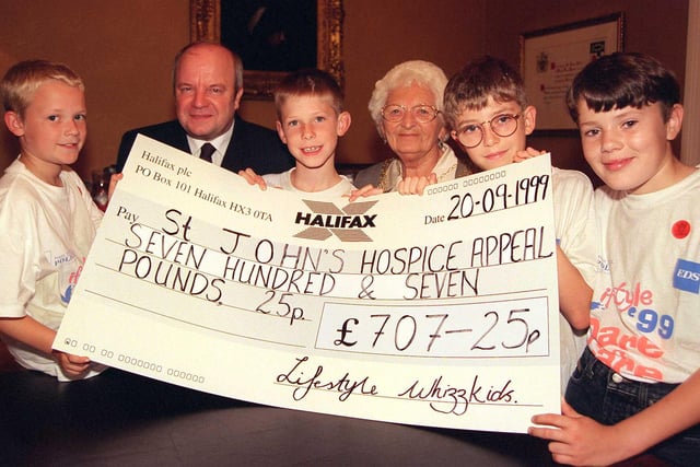 The Whizzkids, raised just over £700 for the St John's Hospice in 1999. Our picture shows the Mayor of Doncaster, Councillor Margaret Robinson and Hospice treasurer Alan Dootson accepting the cheque from the whizz kidders. The fund-raising foursome are, from left, David Mallon,  Alex Dickinson, Adam Hewitt and Karl Cooper, all aged ten.
