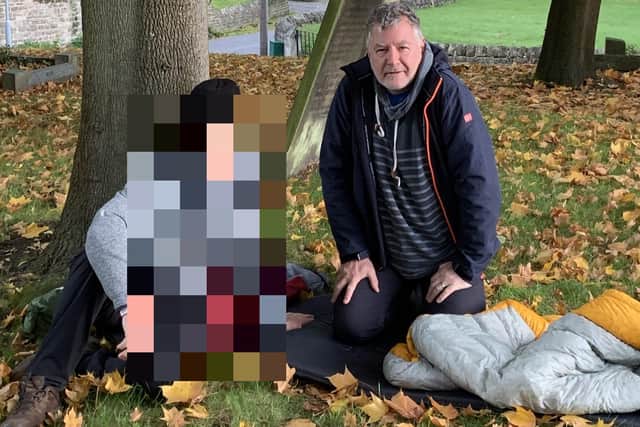 Tim Renshaw, who runs the Archer Project for rough sleepers, slept rough for two weeks as a fundraiser. He is pictured with a friend in one of the church yards where he slept
