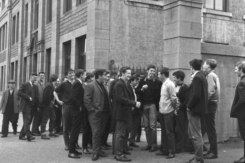 Apprentices are pictured stand outside the gates of engineering company Bertram & Son Ltd on Leith Walk in June 1966.