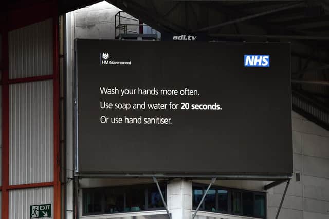 A public health message advising people how to reduce the spread of coronavirus is flashed up on the big screen during a match at Bramall Lane (pic: Anthony Devlin/PA Wire)