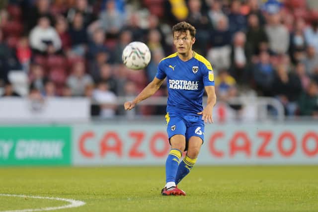 George Marsh of AFC Wimbledon will miss the game against Sheffield Wednesday. (Photo by Pete Norton/Getty Images)