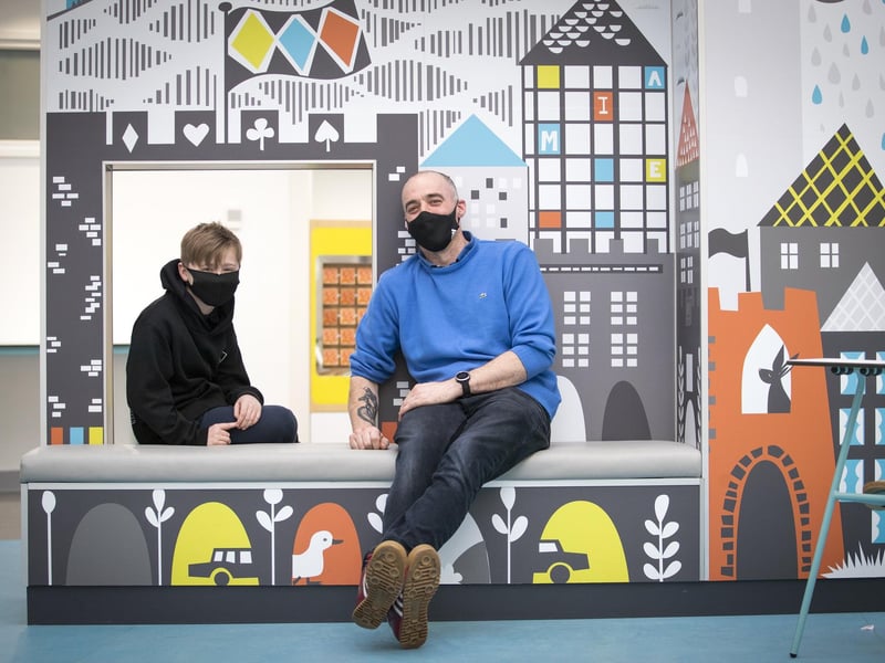 Outpatient Robbie Marshall, 11, with his father Pete Marshall, wait in The Pod area at the new Royal Hospital for Children and Young People Edinburgh.