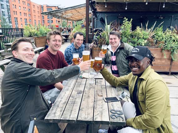 Drinkers toast the reopening of pubs in Sheffield
