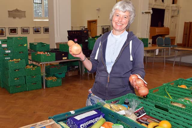 Vicar Claire Dawson with some of the produce the foodbank has been sending out.