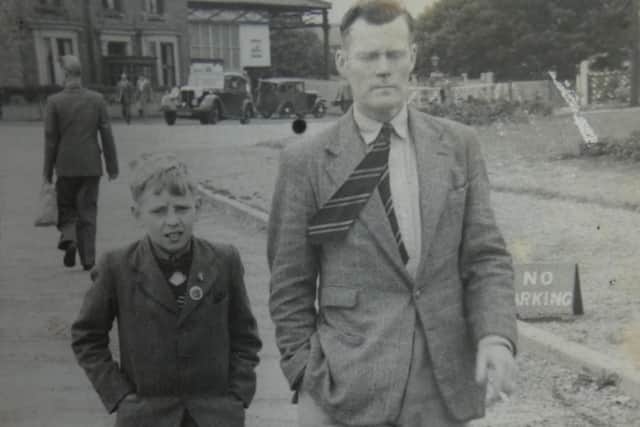 This picture of a man and boy walking was found in an old photograph album in the grounds of Birley Spa