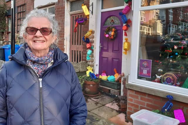 Residents have transformed Boyce Street, Walkley, Sheffield, into a giant Quality Street box to help S6 Foodbank. Pictured is resident Sue Benson