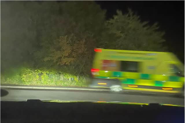 An ambulance pulling away from the scene of a car crash on Owlthorpe Greenway, Sothall, Sheffield, last night