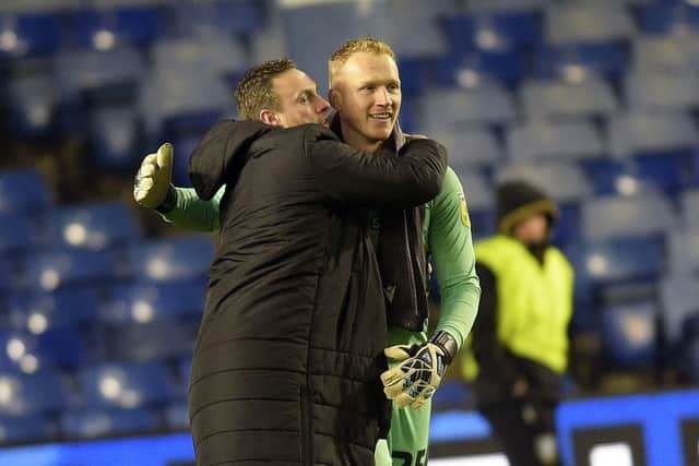 Cameron Dawson celebrated with David Stockdale after helping Sheffield Wednesday win a point against Oxford United.