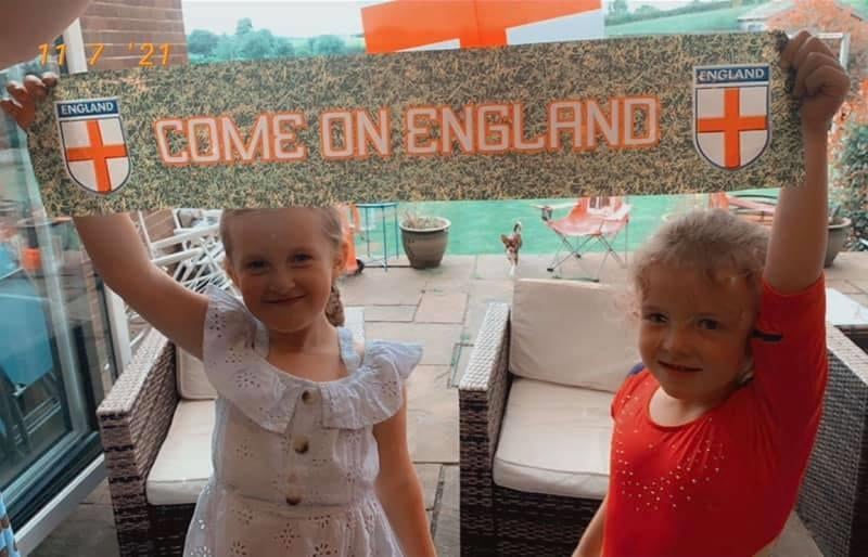 Tia Hewitt posted this picture of adorable Iris and Zara cheering on England.