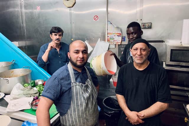 Balti King employees are making and helping to deliver 150 meals to essential workers every day.
