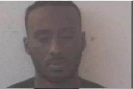 Ahmed Warsame is wanted over the murder of Jordan Thomas