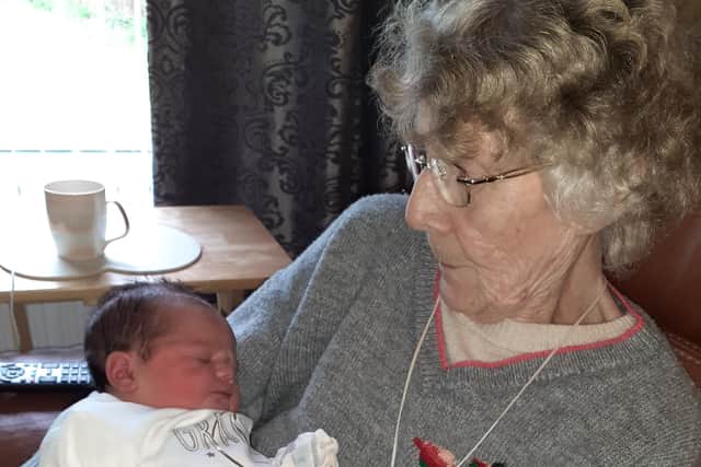 Picture shows Mary Slinn with her youngest great grandson, several years ago. Mary's family say they are unhappy after they were told three days before Christmas that Mary, who usually receives four carer visits a day, will receive no care over Christmas. Submitted picture