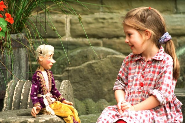 Four-year-old Charlotte Donald made friends with a puppet at the Hamlet in 1996
