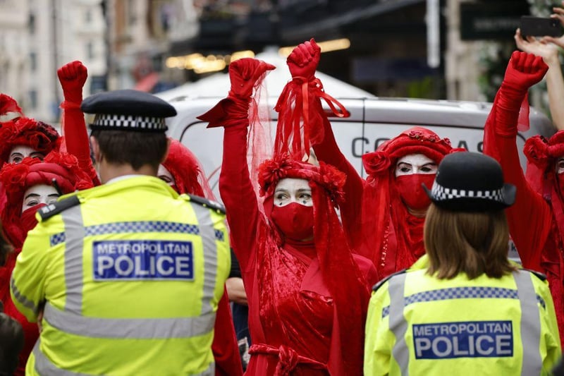 Thousands of climate change demonstrators thronged central London on Monday (23 August), as environmental activist group Extinction Rebellion held its latest round of protests, promising two weeks of disruption. Protesters were greeted with a visibly heavy police presence as they converged on Trafalgar Square in the heart of the British capital, where they rallied with a marching band and speeches. (Photo by TOLGA AKMEN/AFP via Getty Images)