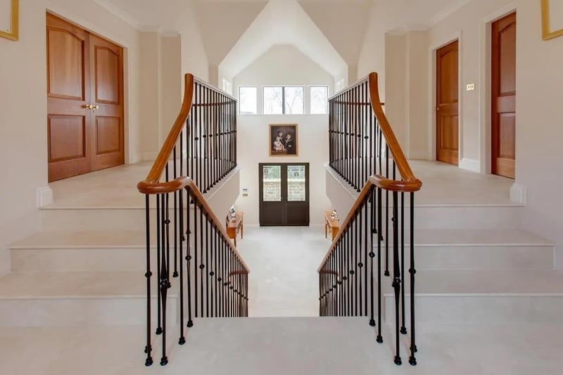 Overlooking the magnificent grand entrance hallway with wall mounted light points, rear facing double glazed panels, tiled flooring and stairs rising to the master bedroom suite and bedrooms two and three.