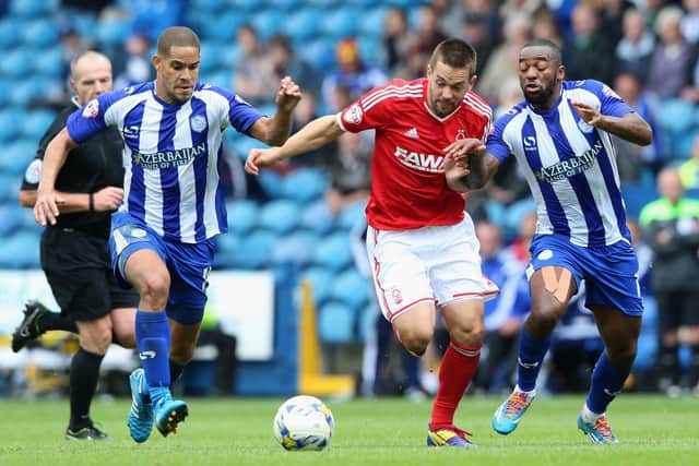 Former Sheffield Wednesday forward Matty Fryatt squeezes between the challenge of Giles Coke and Jacques Maghoma while in the colours of Nottingham Forest.