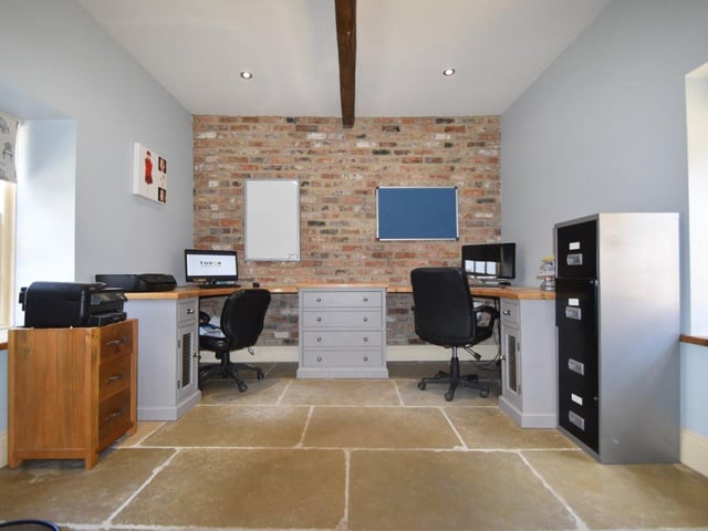 The office space is generous in size and currently accommodates two desks for home working, with plenty of additional room for storage.