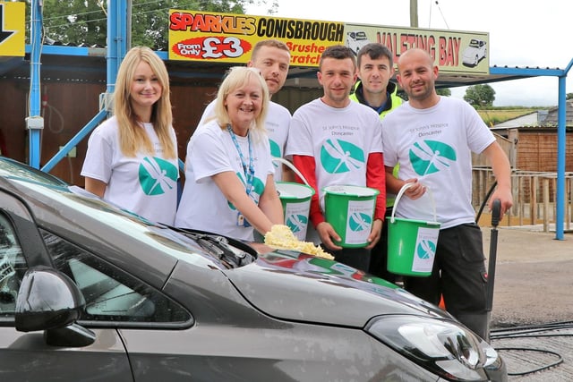 Lindsey Richards, of the St John’s Hospice Appeal (second left), surrounded by volunteers and staff from Sparkles Car Wash in 2016