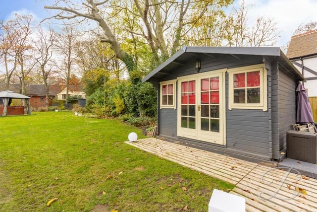 The garden offers lots of outdoor space, including room for outbuildings that can be used for a variety of things.
