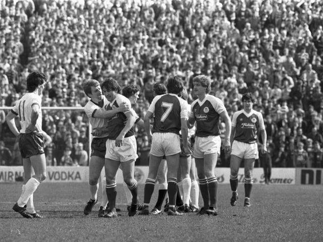 Hibs v Celtic football match at Easter Road in April 1983 - Celtic's Tommy Burns tries to calm Jackie McNamara down after the Hibs player argued with Murdo McLeod.