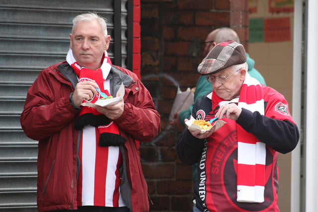 Two Blades fans tuck into their pre-match fish and chips.