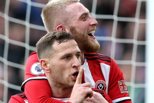 Billy Sharp of Sheffield United celebrates with teammate Oliver McBurnie after scoring against Norwich (Photo by Nigel Roddis/Getty Images)