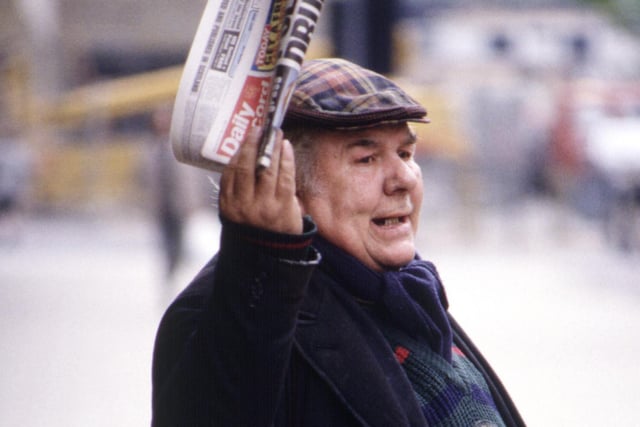 An elderly Glasgow man in a tartan bunnet selling the Daily Record in August 1990.