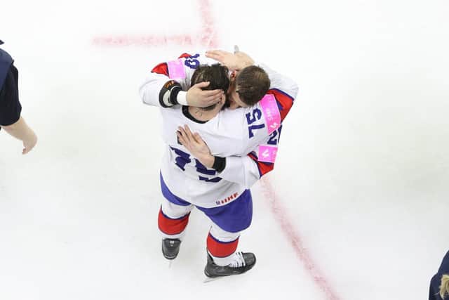 Robert Dowd and Jonathan Phillips embrace in Phillips' last GB game