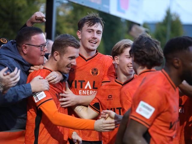 Peterborough Sports celebrate the winning goal from Dan Jarvis (left). Photo Darren Wiles