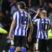 Barry Bannan of Sheffield Wednesday consoles Jonson Clarke-Harris of Peterborough United after the penalty shoot-out. Photo: Joe Dent/theposh.com