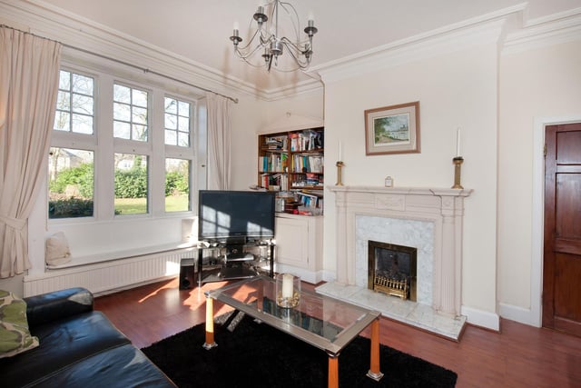 This cosy sitting room is one of the three reception rooms.
