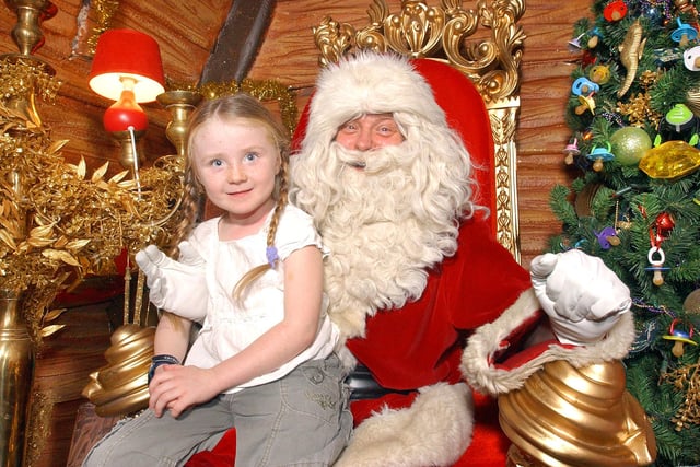 Kaitlin Pringle meets Santa in his grotto in The Bridges in 2006.