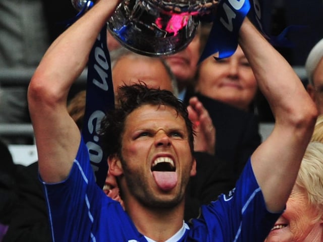 Hermann Hreidarsson celebrates with the trophy Photo by Shaun Botterill/Getty Image